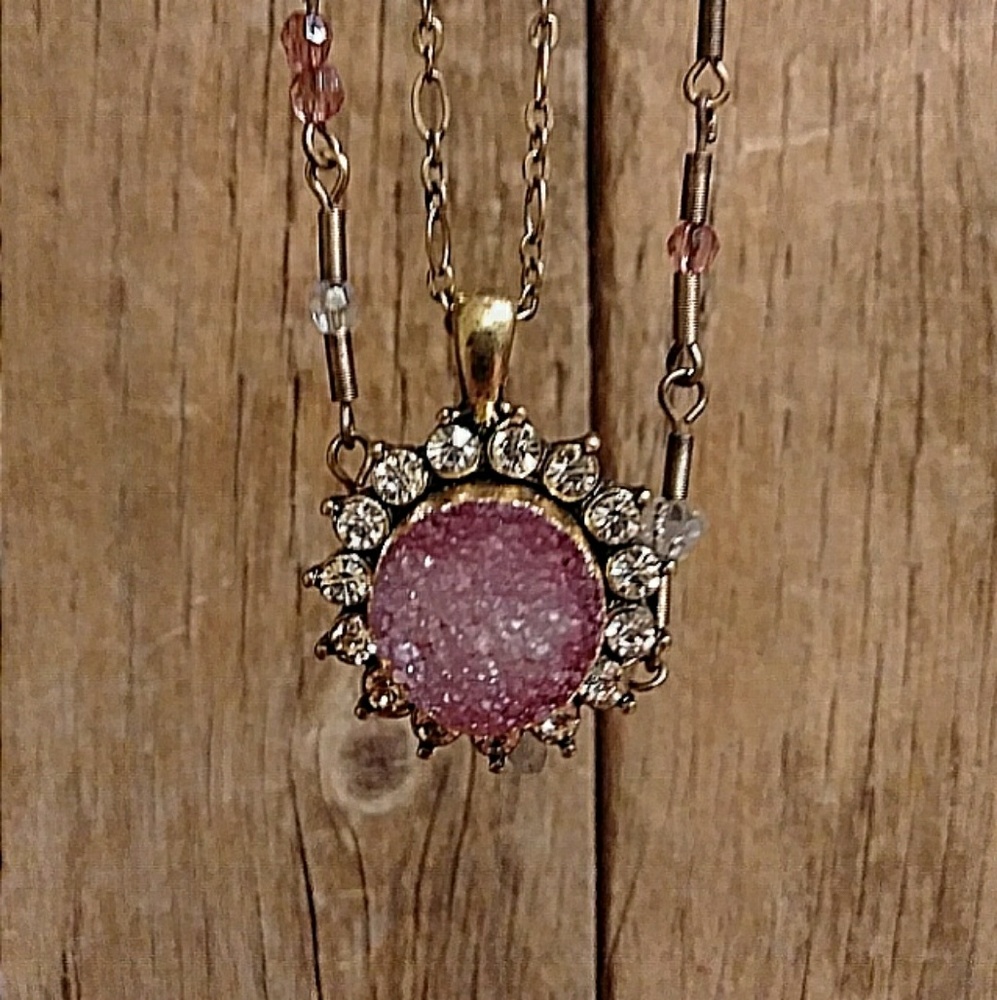 Pretty pink crystal rock pendant